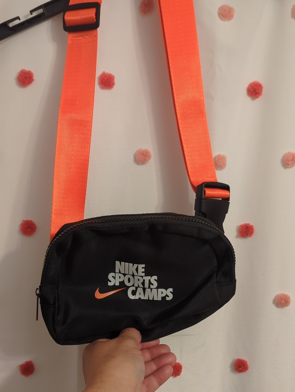 Nike black belt bag with bright orange strap